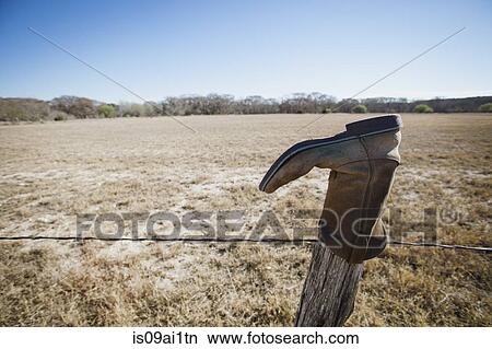 Abandoned boot on fencepost, Texas, USA View Large Photo Image Picture - Abandoned boot on fencepost, Texas, USA. Fotosearch
