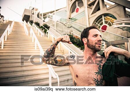 Bare chested mid adult male runner flexing muscles on steps View Large Photo Image Stock Photography - Bare chested mid adult male runner flexing muscles on steps. Fotosearch