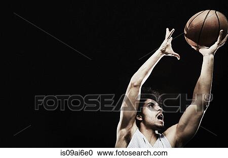 Basketball player catching basketball View Large Photo Image Stock Image - Basketball player catching basketball. Fotosearch