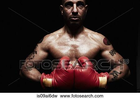 Stock Photo - Boxer wearing boxing gloves. Fotosearch