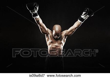 Stock Photo - Boxer with arms raised. Fotosearch