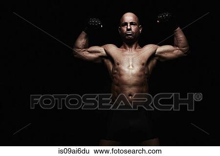 Stock Photograph - Boxer with arms raised. Fotosearch