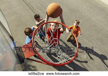Boys playing basketball, high angle View Large Photo Image Stock Photo - Boys playing basketball, high angle. Fotosearch