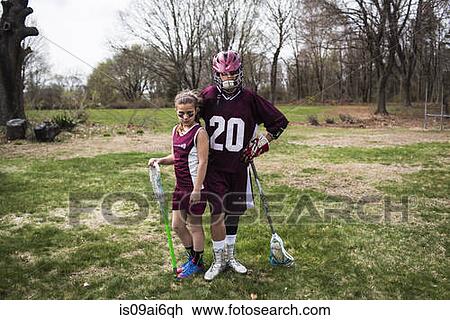 Brother and sister wearing lacrosse uniforms View Large Photo Image Stock Image - Brother and sister wearing lacrosse uniforms. Fotosearch