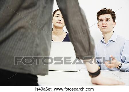 Businesspeople in meeting View Large Photo Image Stock Photograph - Businesspeople in meeting. Fotosearch