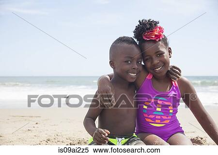 Stock Photography - Children posing on beach. Fotosearch