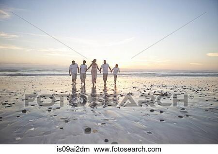 Family holding hands on beach, Cape Town, South Africa View Large Photo Image Picture - Family holding hands on beach, Cape Town, South Africa. Fotosearch