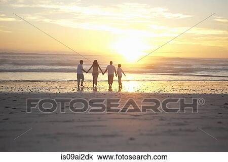 Family holding hands on beach, Cape Town, South Africa View Large Photo Image Stock Image - Family holding hands on beach, Cape Town, South Africa. Fotosearch