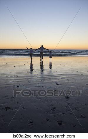 Father and sons walking on beach View Large Photo Image Stock Image - Father and sons walking on beach. Fotosearch