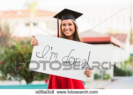 Female graduate holding placard View Large Photo Image Stock Photo - Female graduate holding placard. Fotosearch