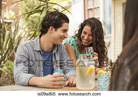 Friends with drinks at backyard barbecue View Large Photo Image Stock Photography - Friends with drinks at backyard barbecue. Fotosearch