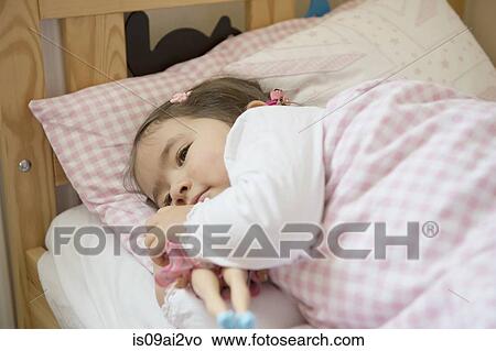 Picture - Girl at bedtime. Fotosearch