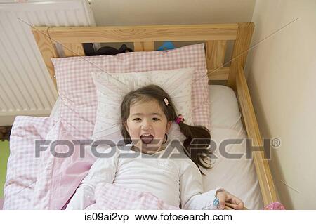 Girl at bedtime View Large Photo Image Stock Photography - Girl at bedtime. Fotosearch