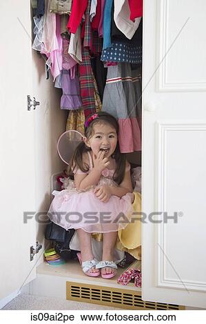 Girl in princess costume hiding in cupboard View Large Photo Image Stock Image - Girl in princess costume hiding in cupboard. Fotosearch