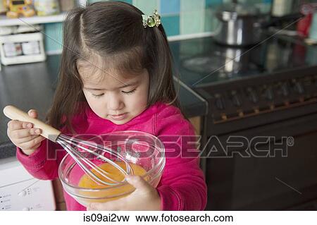 Girl learning to cook View Large Photo Image Stock Photo - Girl learning to cook. Fotosearch