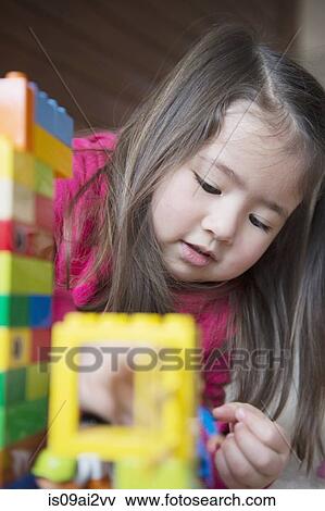 Girl playing by herself View Large Photo Image Stock Photo - Girl playing by herself. Fotosearch