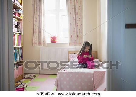 Girl playing by herself View Large Photo Image Stock Photograph - Girl playing by herself. Fotosearch