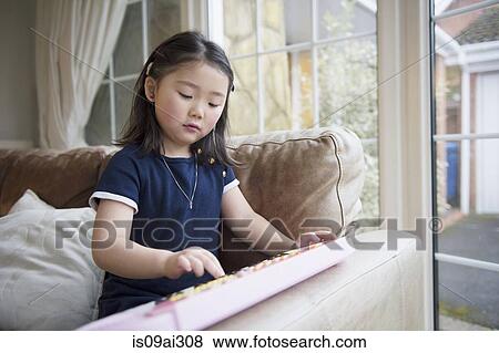 Girl playing toy keyboard View Large Photo Image Stock Photo - Girl playing toy keyboard. Fotosearch