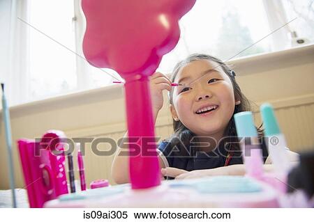 Girl putting make up on View Large Photo Image Stock Photography - Girl putting make up on. Fotosearch