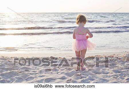 Stock Image - Girl wearing tutu on beach in Tulum, Mexico. Fotosearch