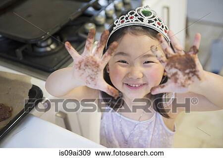 Girl with dirty hands, wearing crown View Large Photo Image Stock Photo - Girl with dirty hands, wearing crown. Fotosearch