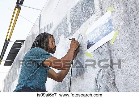 Male african american airbrush artist painting mural View Large Photo Image Stock Photo - Male african american airbrush artist painting mural. Fotosearch