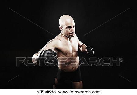 Picture - Mature man punching. Fotosearch