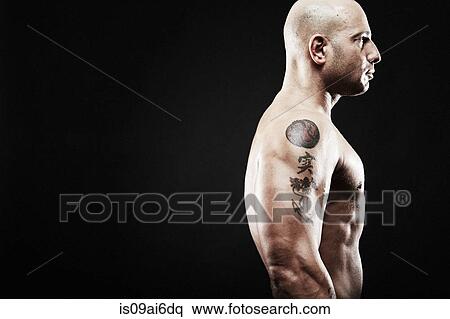 Mature man with tattoos on arm, side view View Large Photo Image Stock Photography - Mature man with tattoos on arm, side view. Fotosearch