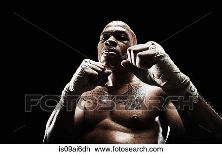 Mid adult man boxing View Large Photo Image Stock Image - Mid adult man boxing. Fotosearch