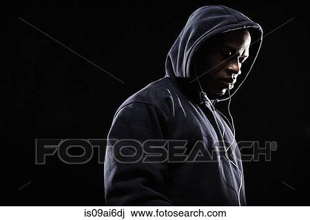 Mid adult man wearing hooded top View Large Photo Image Stock Image - Mid adult man wearing hooded top. Fotosearch