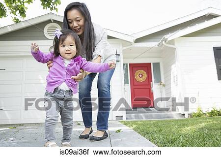 Mid adult woman and female toddler taking steps View Large Photo Image Stock Image - Mid adult woman and female toddler taking steps. Fotosearch
