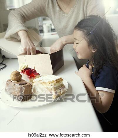 Mother and daughter with box of cakes View Large Photo Image Stock Photo - Mother and daughter with box of cakes. Fotosearch