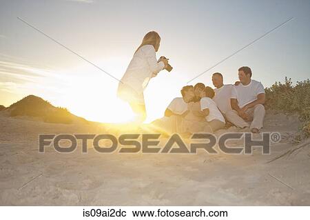 Photographer taking family portrait on beach, Cape Town, South Africa View Large Photo Image Stock Image - Photographer taking family portrait on beach, Cape Town, South Africa. Fotosearch