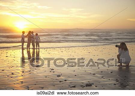 Photographer taking family portrait on beach, Cape Town, South Africa View Large Photo Image Stock Image - Photographer taking family portrait on beach, Cape Town, South Africa. Fotosearch
