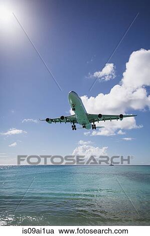 Plane landing, Mullet Bay, St Maarten Island, Netherlands View Large Photo Image Stock Image - Plane landing, Mullet Bay, St Maarten Island, Netherlands. Fotosearch