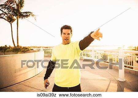 Portrait of confident mature male trainer View Large Photo Image Stock Photo - Portrait of confident mature male trainer. Fotosearch