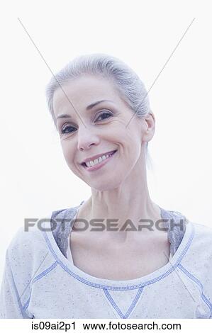 Stock Image - Portrait of happy mature woman. Fotosearch