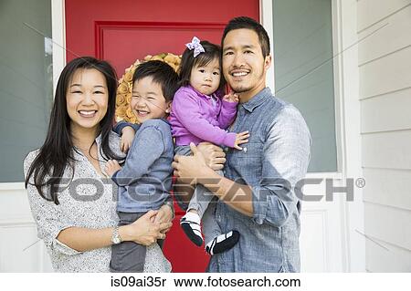 Portrait of mid adult couple and two young children on porch View Large Photo Image Stock Photography - Portrait of mid adult couple and two young children on porch. Fotosearch