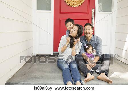 Portrait of mid adult couple with young son and daughter on porch View Large Photo Image Stock Photo - Portrait of mid adult couple with young son and daughter on porch. Fotosearch