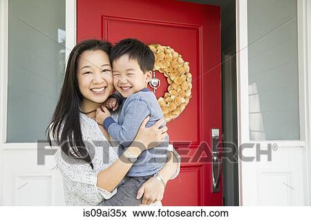 Portrait of mid adult woman and young son on porch View Large Photo Image Stock Photo - Portrait of mid adult woman and young son on porch. Fotosearch