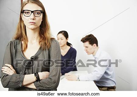 Portrait of woman wearing glasses, arms folded View Large Photo Image Stock Photography - Portrait of woman wearing glasses, arms folded. Fotosearch