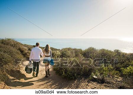 Romantic young couple strolling on coastal path, Torrey Pines, San Diego, California, USA View Large Photo Image Picture - Romantic young couple strolling on coastal path, Torrey Pines, San Diego, California, USA. Fotosearch