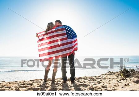 Romantic young couple wrapped in american flag, Torrey Pines, San Diego, California, USA View Large Photo Image Stock Image - Romantic young couple wrapped in american flag, Torrey Pines, San Diego, California, USA. Fotosearch