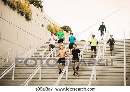 Small group of runners training on convention center stairs View Large Photo Image Stock Photo - Small group of runners training on convention center stairs. Fotosearch