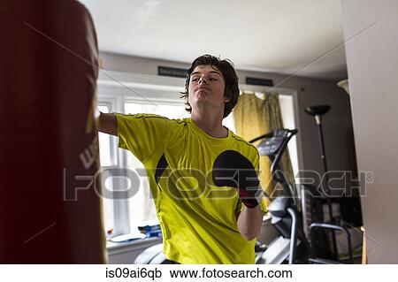 Teenage boy wearing boxing gloves View Large Photo Image Stock Image - Teenage boy wearing boxing gloves. Fotosearch