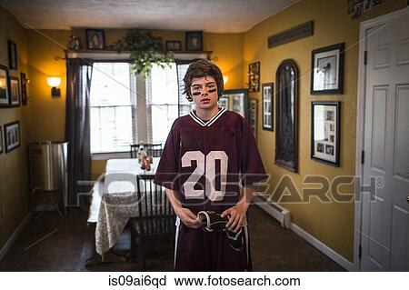 Teenage boy wearing lacrosse uniform, standing in dining room View Large Photo Image Stock Image - Teenage boy wearing lacrosse uniform, standing in dining room. Fotosearch