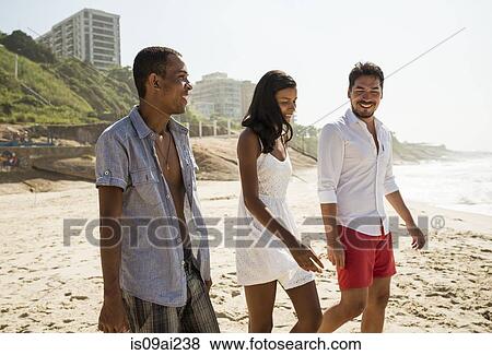 Three friends strolling on Arpoador beach, Rio De Janeiro, Brazil View Large Photo Image Stock Photo - Three friends strolling on Arpoador beach, Rio De Janeiro, Brazil. Fotosearch