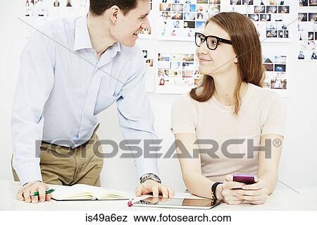 Two colleagues in creative studio View Large Photo Image Stock Photo - Two colleagues in creative studio. Fotosearch