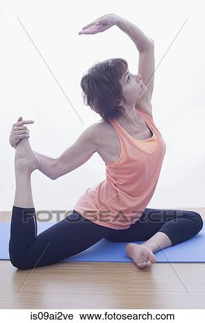 Woman in backbent pose View Large Photo Image Stock Image - Woman in backbent pose. Fotosearch