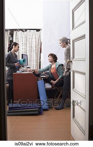 Women chatting in office View Large Photo Image Stock Image - Women chatting in office. Fotosearch
